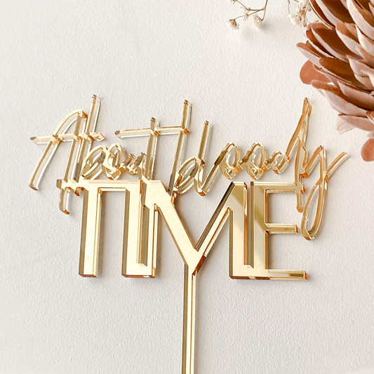 Funny “About Bloody Time” GOLD cake topper in modern acrylic design, ideal for weddings, anniversaries, or engagement celebrations. This topper captures the playful spirit of finally tying the knot after delays or a long wait. Customisable in colours to match your theme, it’s lightweight, durable, and handcrafted in Australia. The perfect humorous cake decoration and keepsake for couples wanting unique, fun wedding décor.