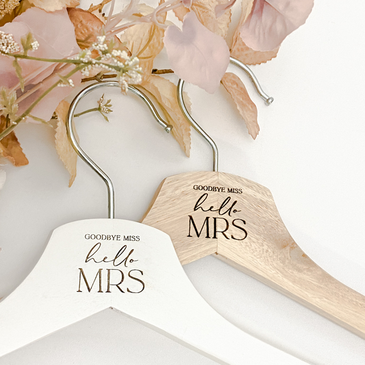 Custom engraved wedding coat hanger featuring personalised name, date, or title for the bride or bridal party. Designed in premium wood, this elegant hanger makes a lasting keepsake and practical gift for weddings, engagements, or bridal showers. Perfect for displaying wedding dresses and bridesmaid gowns while adding a sentimental touch to your day. Handcrafted in Australia, a meaningful wedding gift.