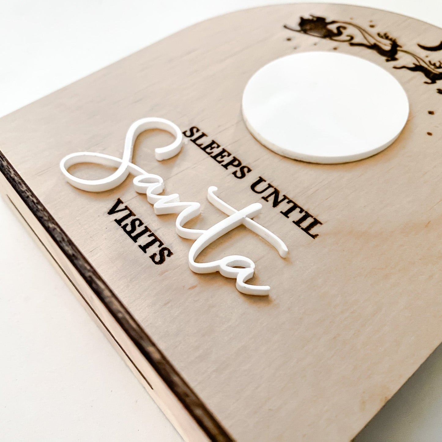 Close-up of the white dry-erase whiteboard centre on the wooden Christmas countdown sign