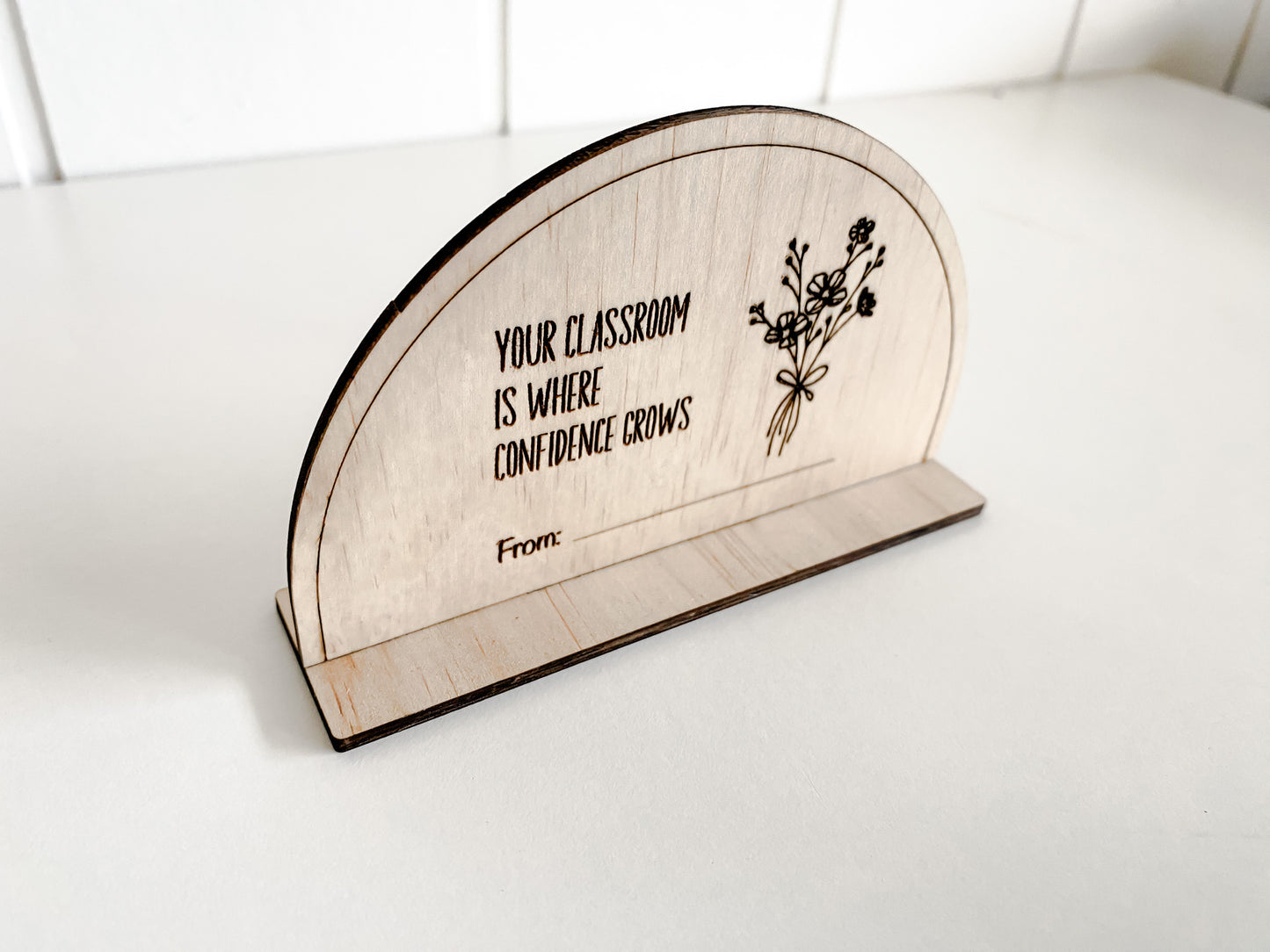 An elegant wooden sign, sized 11.5cm x 7cm, designed as stylish classroom decor.