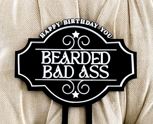 Retro Bearded Badass Cake Topper displayed on a decorated birthday cake, handcrafted in premium acrylic with bold retro lettering and cheeky design. Perfect novelty topper for adult birthdays, buck’s nights, or fun celebrations, this topper adds humour and style. Durable, lightweight, and available in multiple colours, custom made in Australia for standout party décor and unforgettable events.