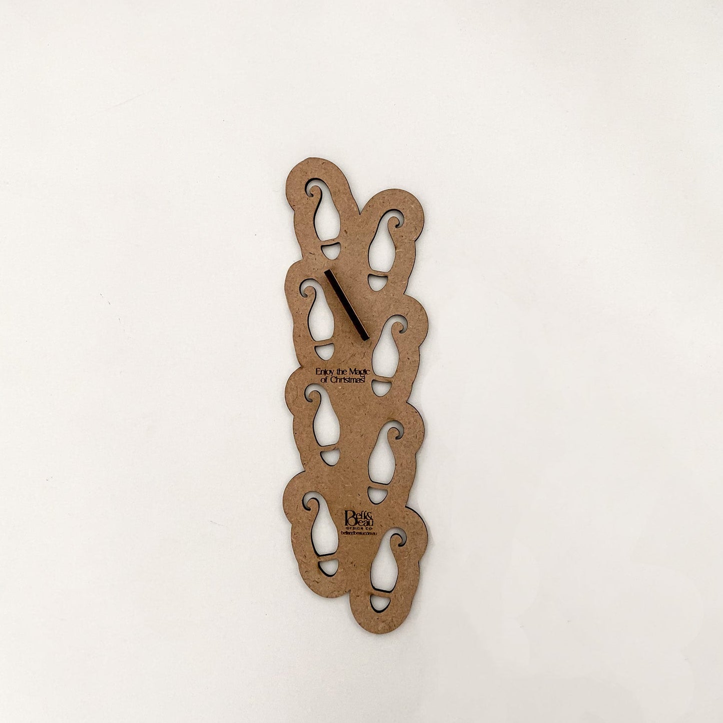 The Elf Boot Stencil lying flat, highlighting the "Enjoy the Magic of Christmas!" text on the extra tab for easy lifting.