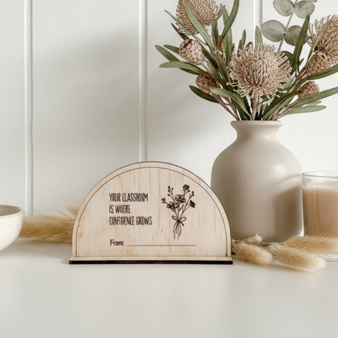 Teacher Gift Desk Plaque, on a white shelf with decorative pastels styling elements.