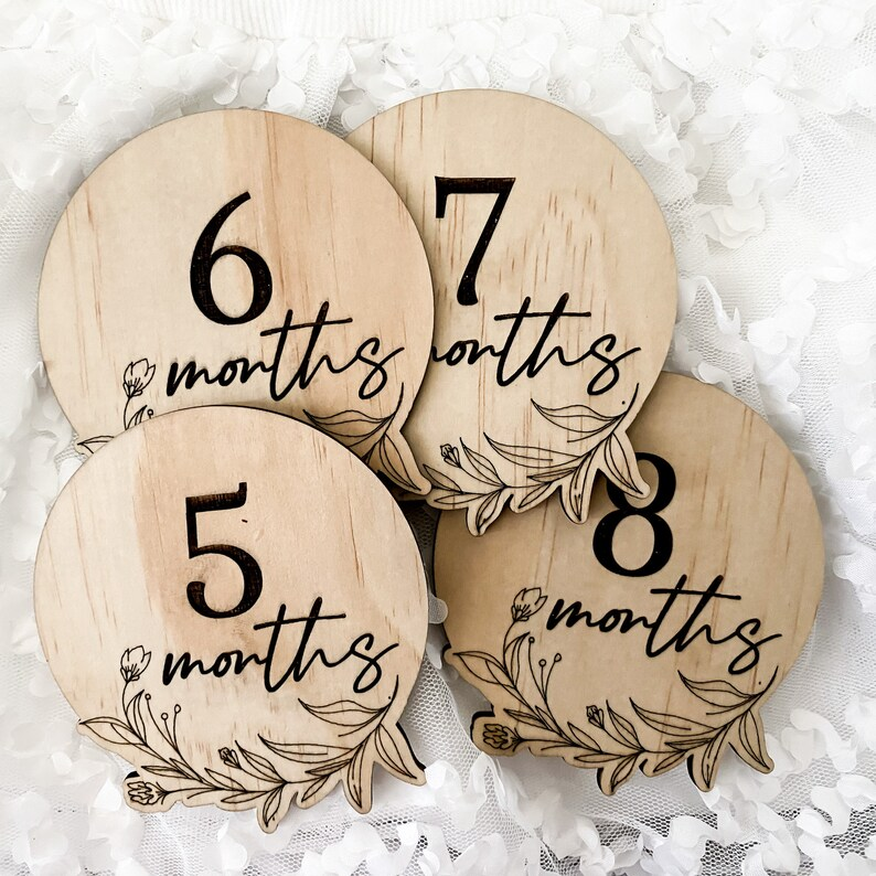 Baby monthly milestone discs crafted from engraved wood with a floral design. This 13-piece photo prop set marks your child’s journey from “Hello World” to “One Year.” Perfect for parents capturing monthly photos, gifting at baby showers, or keeping as timeless wooden keepsakes. Eco-friendly, sustainable, and handmade in Australia, these discs complement all photo themes while celebrating each milestone beautifully.