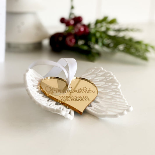 Side view of 3D in loving memory angel with heart. White wings with Gold coloured heart with Grandmother forever in our hearts engraved on gold acrylic.