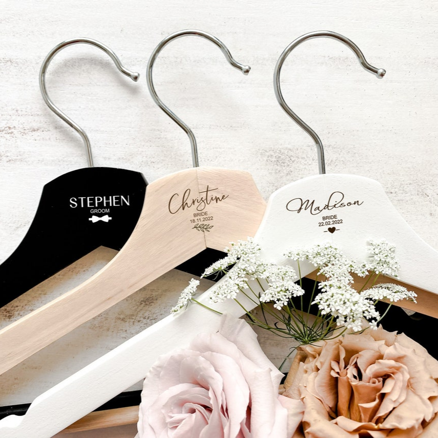 Personalised wooden wedding coat hanger, custom engraved with names, titles, and dates. Ideal for brides, grooms, bridesmaids, and groomsmen, this handcrafted hanger is a stylish keepsake that elevates wedding photography. A lasting gift for bridal parties, flower girls, or anniversaries, designed in Australia. Perfect personalised wedding accessory and keepsake gift.