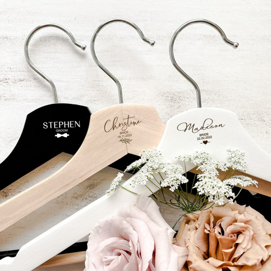 Personalised wooden wedding coat hanger, custom engraved with names, titles, and dates. Ideal for brides, grooms, bridesmaids, and groomsmen, this handcrafted hanger is a stylish keepsake that elevates wedding photography. A lasting gift for bridal parties, flower girls, or anniversaries, designed in Australia. Perfect personalised wedding accessory and keepsake gift.