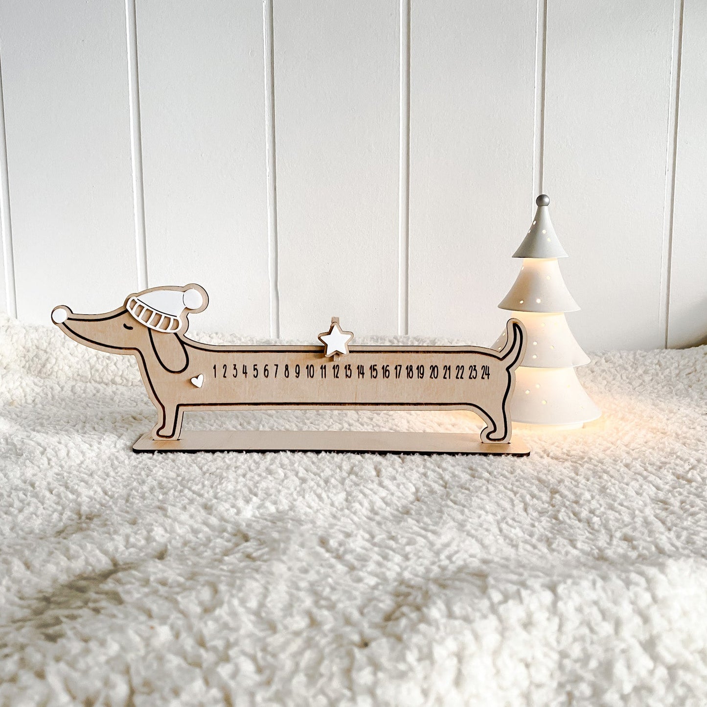 Reusable wooden Christmas countdown plaque shaped like a Dachshund.
