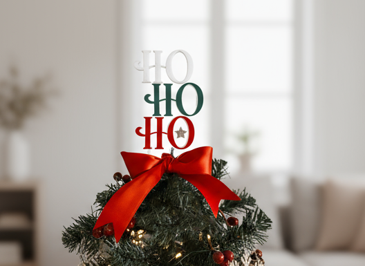 Modern Ho Ho Ho Acrylic Christmas Tree Topper handmade by Bell & Beau Design Co, featuring layered red, green and white acrylic letters with a silver star accent and red satin ribbon. A festive, lightweight holiday decoration made in Australia, ideal for small and standard trees.