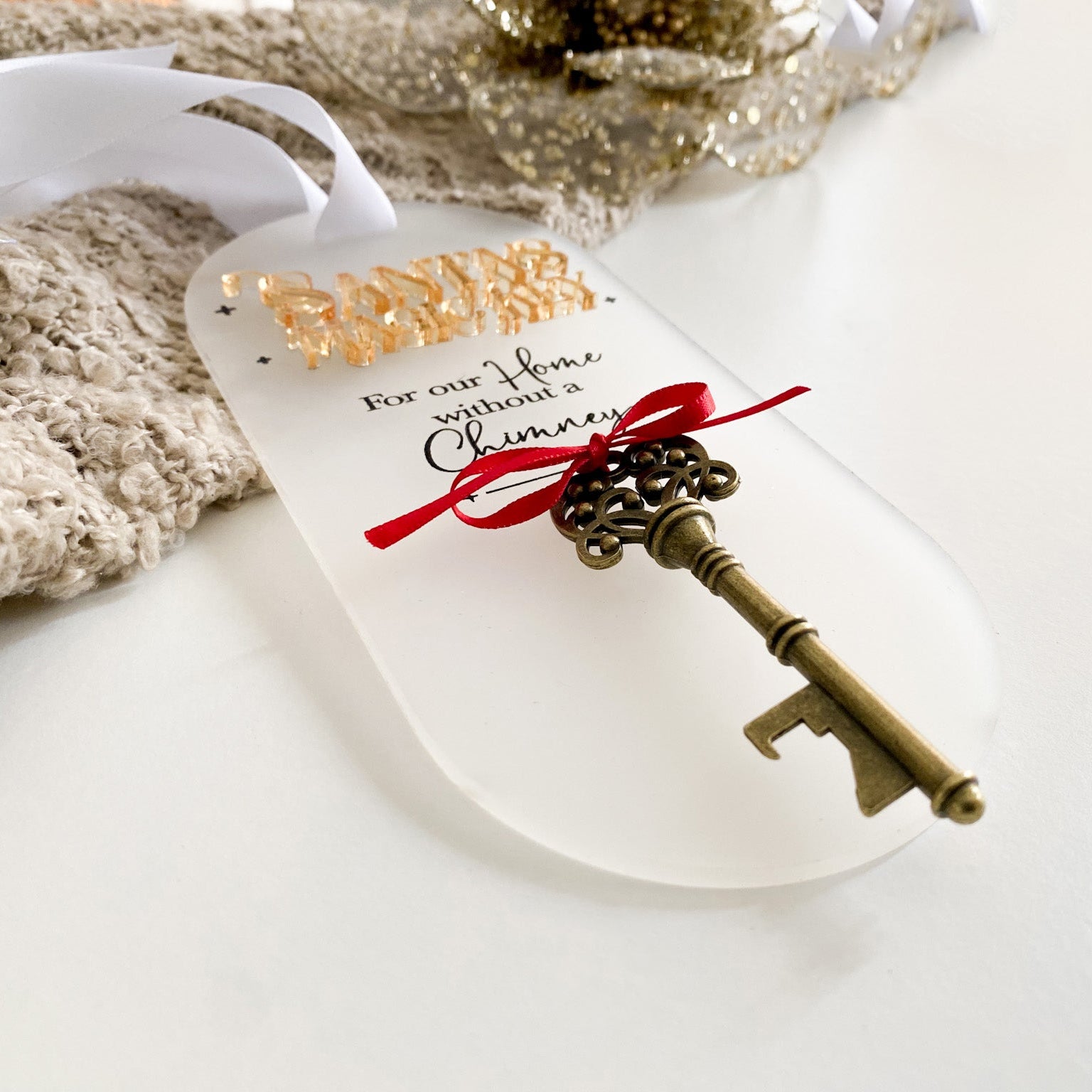 Frosted white acrylic Santa’s Magic Key door hanger with elegant gold acrylic text, black script, and vintage-style key. An imaginative keepsake to create Christmas Eve magic, handmade in Australia by Bell & Beau Design Co.