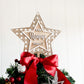Rustic rattan star tree topper, engraved family name, eco friendly FSC plywood with red bow, sustainable handmade holiday décor.