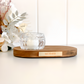 Elegant remembrance tealight candle holder with engraved wood base and glass tealight cup. Personalised plaque available in silver or gold with optional message on top. A thoughtful sympathy gift for grieving families, a keepsake for anniversaries, or tribute piece for home décor. This memorial candle holder provides warmth, comfort, and lasting memory.