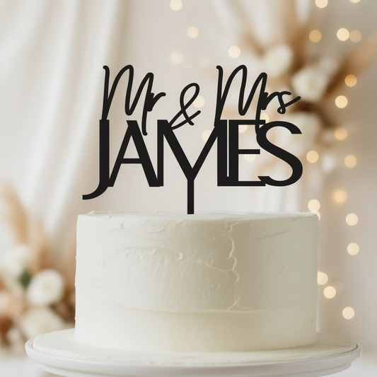 Personalised Mr & Mrs acrylic wedding cake topper displayed on a tiered wedding cake, custom-made in Australia with elegant lettering. Perfect for couples wanting a timeless and modern touch to their celebration. Ideal for weddings, anniversaries, and engagements, this lightweight yet durable topper serves as a keepsake décor piece long after the event, enhancing cake styling with a romantic finish. Created by Bell & Beau Design Co in the South Burnett Region, QLD, Australia.