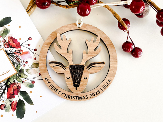 Beautiful wooden reindeer Christmas ornament designed as an eco-friendly Christmas bauble and personalised gift for the festive season. This custom ornament features a reindeer silhouette inside a circular frame, perfect for hanging on your Christmas tree as a tree ornament or Christmas tag. A charming keepsake for My First Christmas, Christmas name display, or thoughtful gift for Christmas—handcrafted in natural wood and available in four colours.