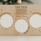 Close-up of engraved text on plywood Santa tray showing acrylic inserts and star engravings, highlighting craftsmanship and festive detail.