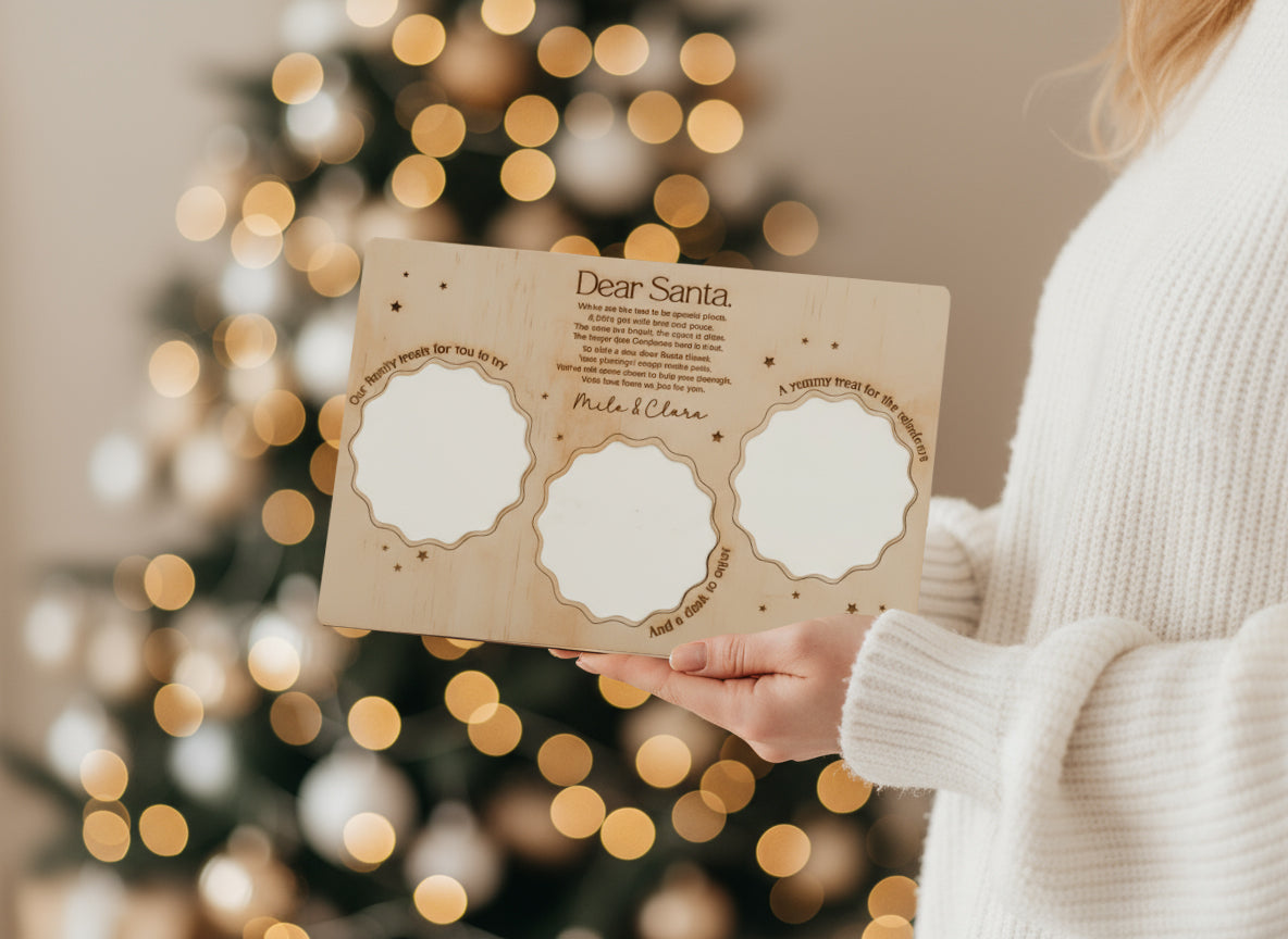 woman holding an engraved Santa treat tray surrounded by a Christmas Eve setup.