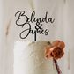 Personalised acrylic wedding cake topper in modern script font featuring custom names. Elegant, laser-cut cake decoration designed to suit weddings, engagements, anniversaries, and special events. Lightweight yet durable acrylic makes it the perfect keepsake. Stylish black lettering enhances your cake display, ideal for couples seeking custom wedding décor and unique personalised details.