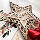 Wooden rattan star Christmas topper with personalised family name, red ribbon tie, eco friendly holiday décor, handmade in Australia.