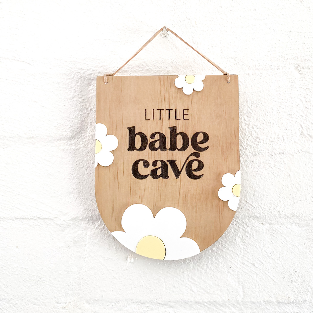 Reverse arch LIttle babe cave wall sign with white and yellow daises