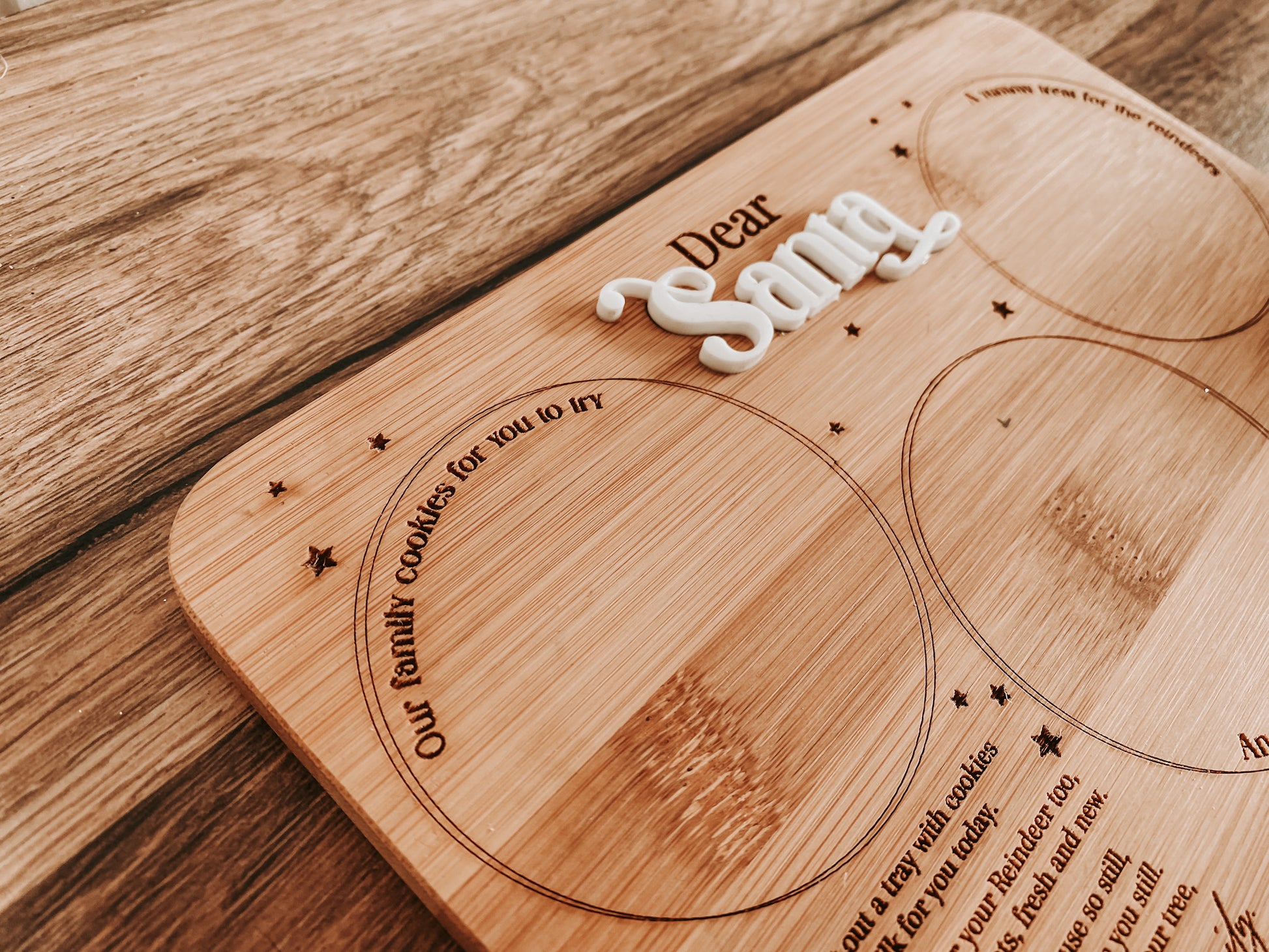 Close-up detail of engraved lettering on sustainable bamboo Christmas Eve Santa tray, showing the poem and whimsical stars. Eco-friendly, Australian-made holiday décor that helps families create cherished festive rituals with cookies, milk and carrots for Santa and the reindeer.