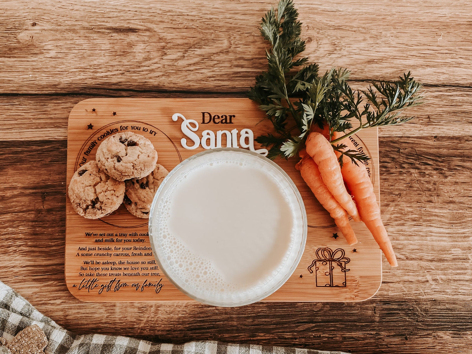 Minimalistic product photo of engraved bamboo Santa tray on wooden surface. Showcases laser-engraved details and clean finish — ideal for online store display and product listing clarity. Sustainable Christmas décor made in Australia.