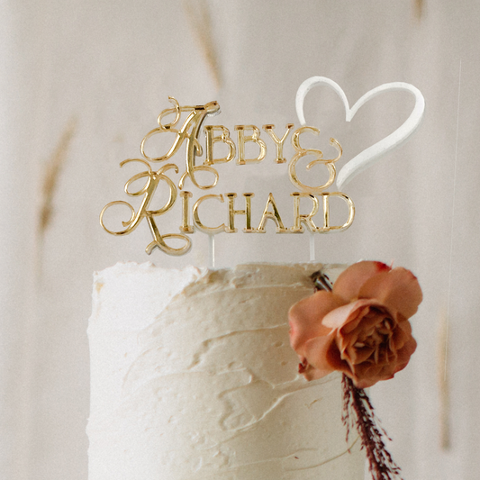 Stylish 3D layered gold personalised wedding cake topper with names in script font and heart, adding elegance to a romantic wedding cake. Available in a multiple of colours and 3 different sizes. Designed & created by Bell & Beau Design Co in the South Burnett Region, QLD, Australia.