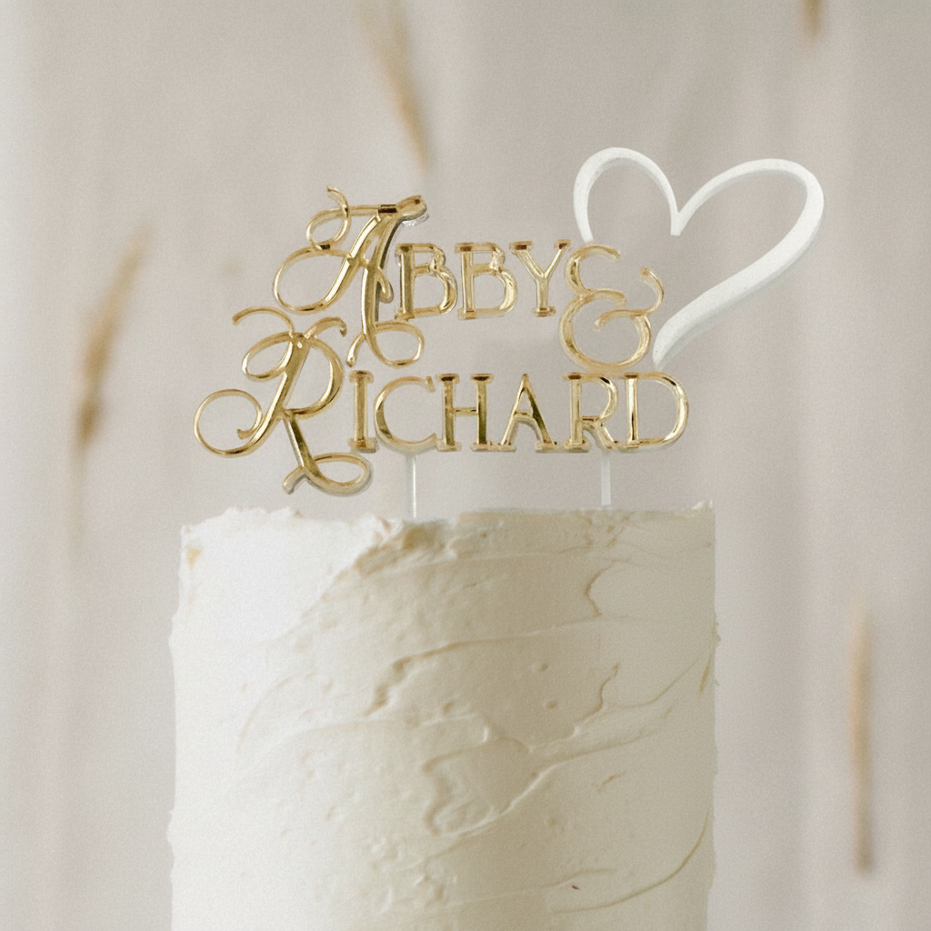 Stylish 3D layered gold personalised wedding cake topper with names in script font and heart, adding elegance to a romantic wedding cake. Available in a multiple of colours and 3 different sizes. Designed & created by Bell & Beau Design Co in the South Burnett Region, QLD, Australia.