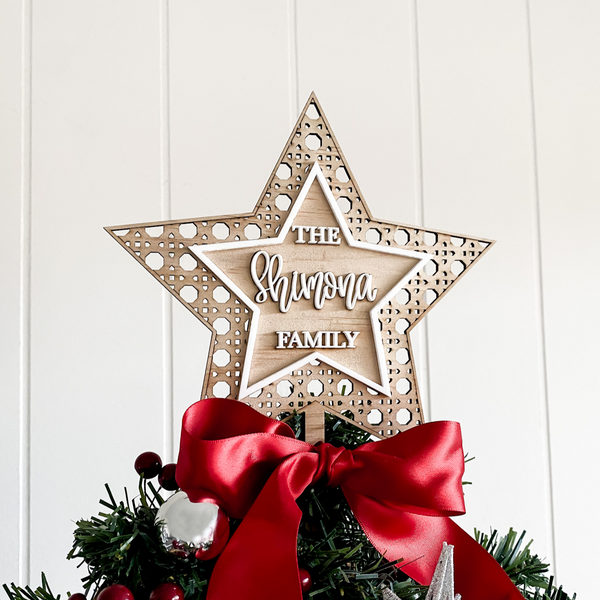 Custom Rattan Star Christmas Tree Topper made from wood and acrylic, 3D - double layered with a large premium satin red bow. Made in Australia by Bell & Beau Design Co