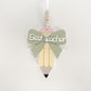 layered acrylic teacher appreciation ornament with a green bow and the words Best Teacher
