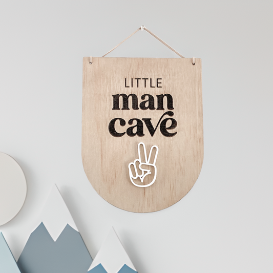 Wooden Little Man Cave Wall Decor sign shaped like a pennant flag with black laser-engraved text.