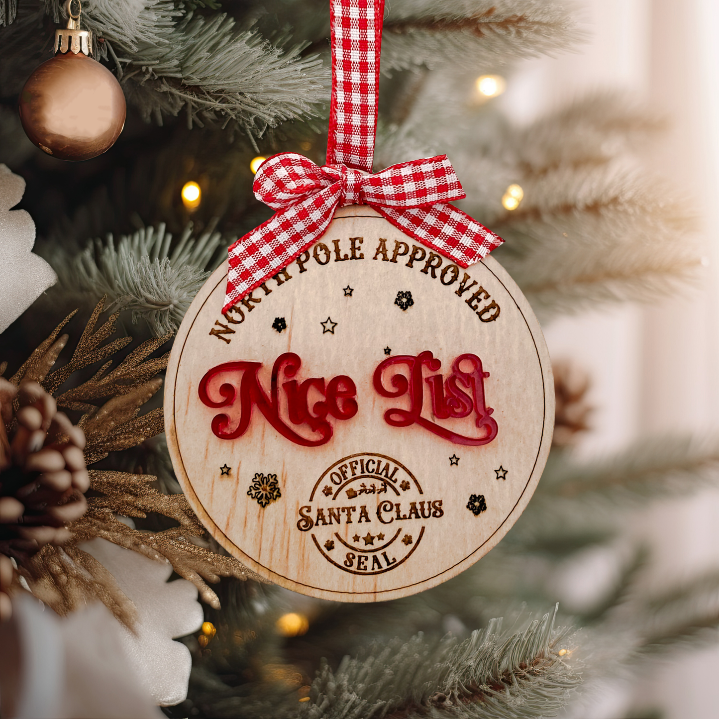 Detailed view of the laser-engraved wooden Nice List Ornament featuring the "Official Santa Claus Seal" and "North Pole Approved" text