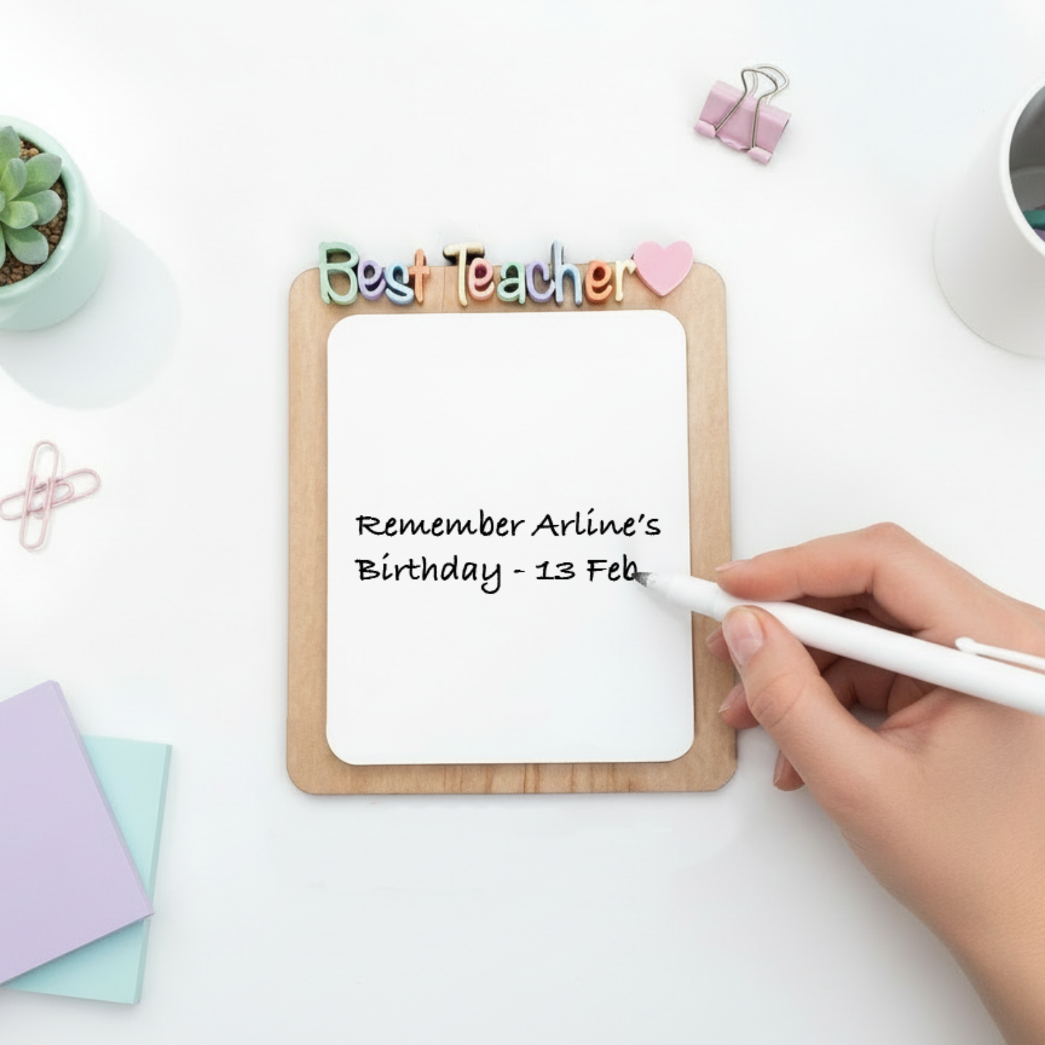 Teacher appreciation dry erase desk notepad with a wooden back and acrylic front, featuring colourful Best Teacher letters.