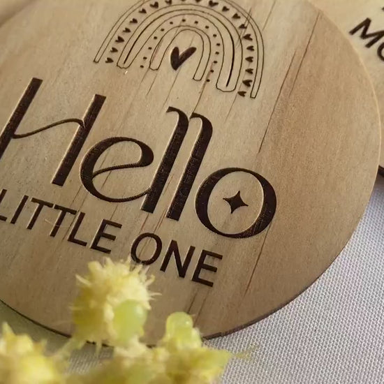 Beautiful rainbow milestone discs for babies, laser-engraved on sustainable FSC-certified wood. This 13-piece set includes “Hello Little One,” months one to eleven, and “One Year,” each designed for milestone photography and memory keeping. Ideal for newborn announcements, monthly photo updates, and gifts for expecting parents. A timeless keepsake, these wooden milestone discs capture your baby’s growth journey while adding charm to photos and nursery décor.