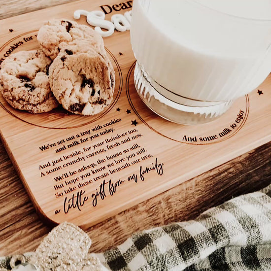Rustic Christmas styling with checkered fabric bow and festive berries beside wooden Santa tray. Warm neutral tones and natural texture highlight the handcrafted quality and nostalgic charm of this family-favourite Christmas Eve tradition board.